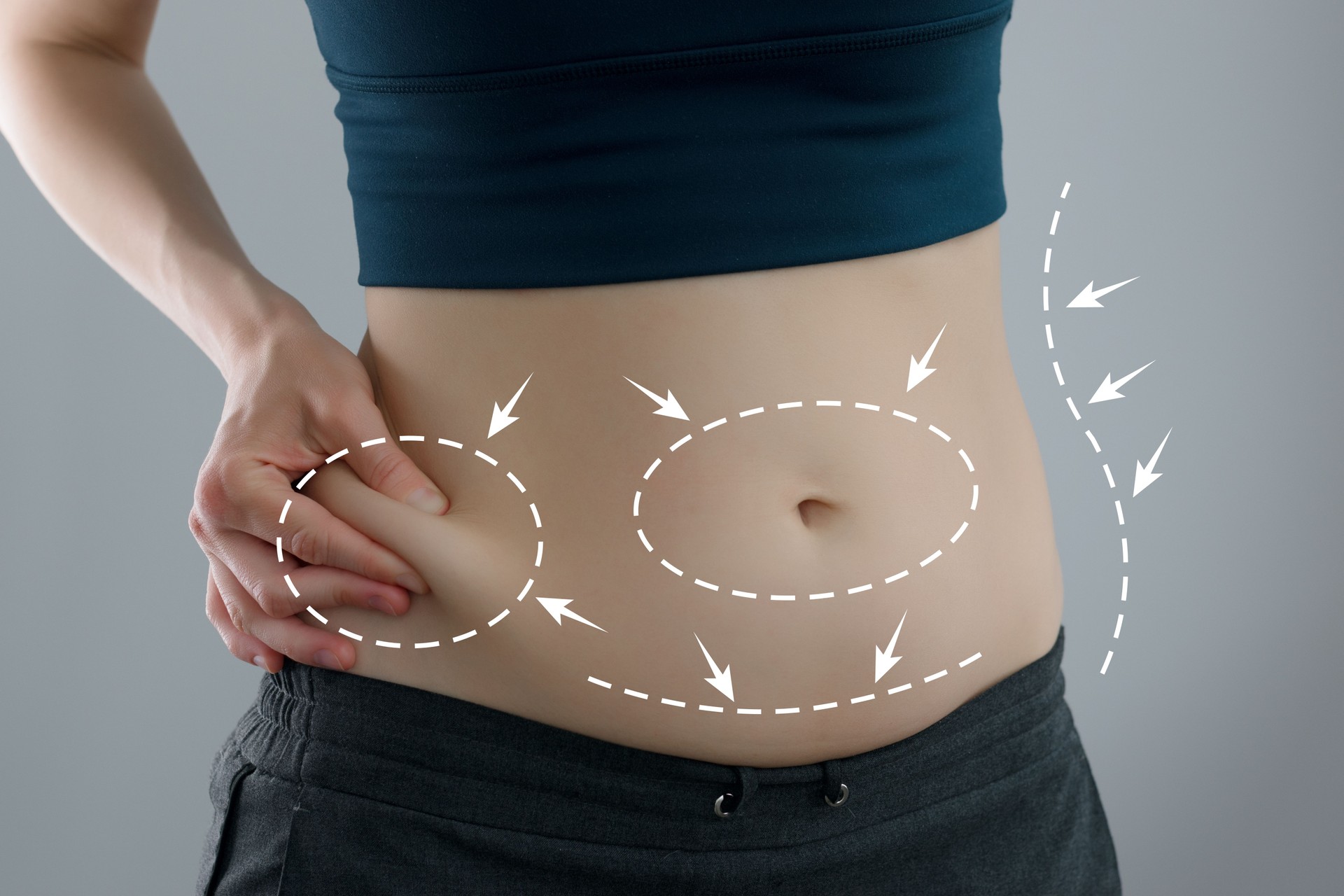 Abdominal fat problems, massaging marks. Healthy lifestyle and sports activities concept