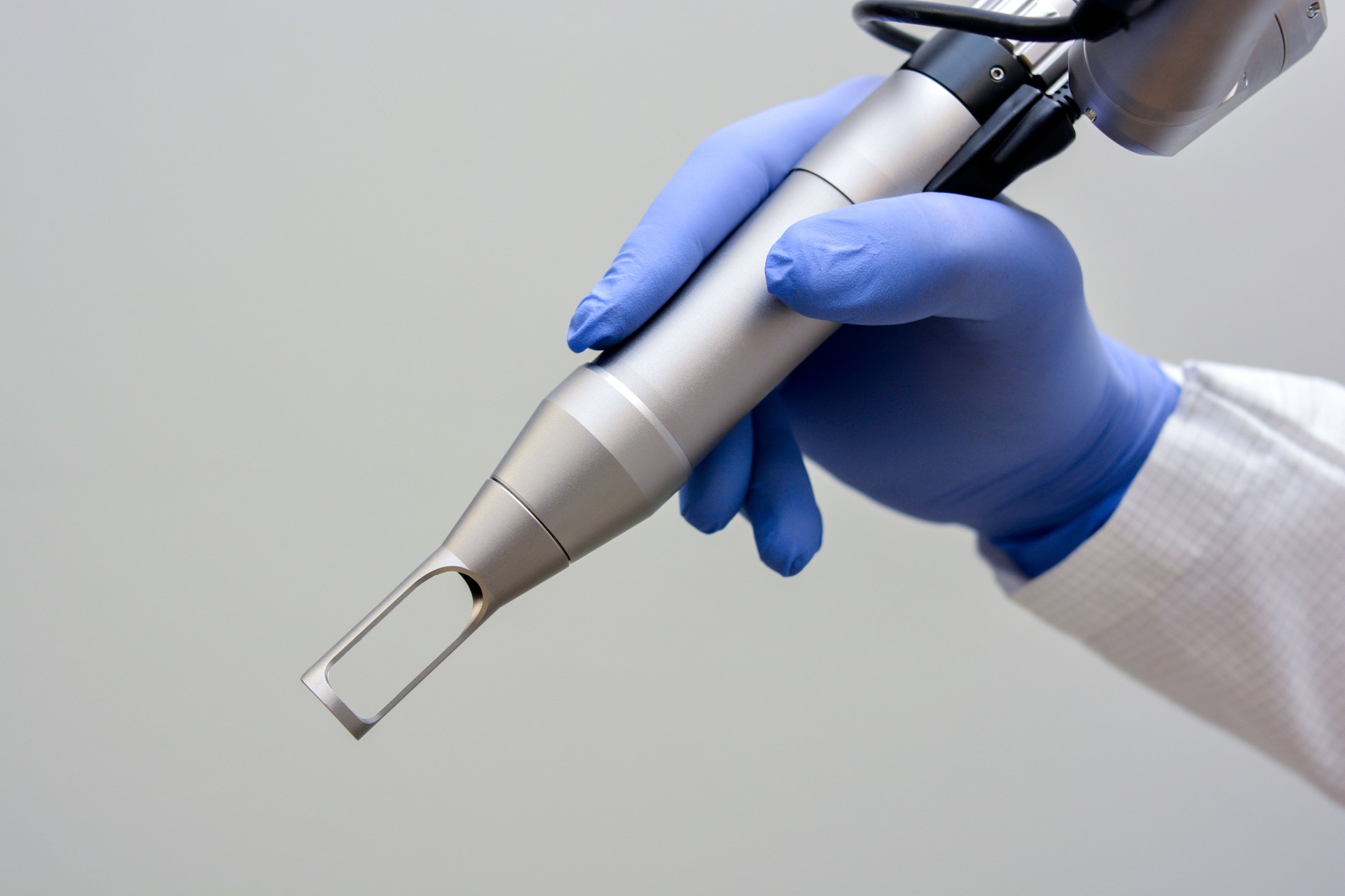 Doctor Holding ND:Yag Laser Hand Piece